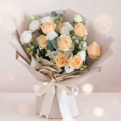 A stunning pink and white rose bridal bouquet accented with fresh green leaves for a classic wedding ceremony.
