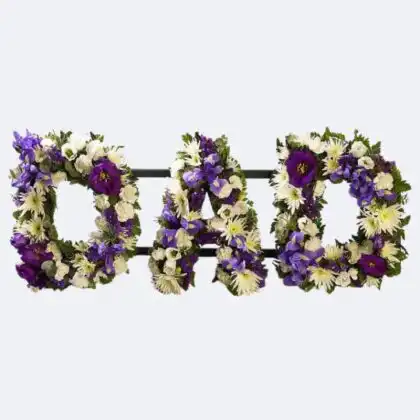 Fresh purple and white floral letters spelling DAD as a meaningful Dad Funeral Tribute for memorial services.