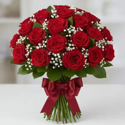 A vibrant 20 roses bouquet of deep red blooms accented with white baby's breath and tied with a satin crimson bow.